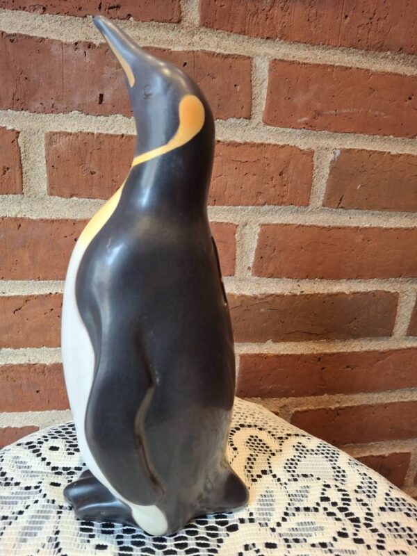 Vintage pingvin sparebøsse set fra siden med gyldne detaljer