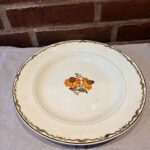 Solbrud middagstallerken med blomstermotiv og patina