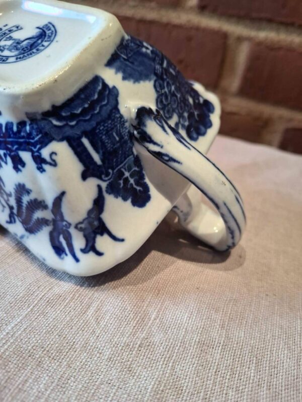 Porcelænshank med blå mønster og patina