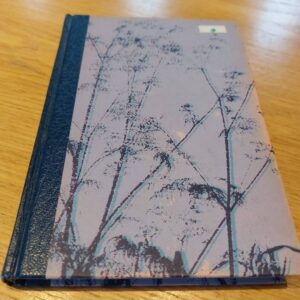 Catherine Cookson bog 'Mallen Skæbner' med mønstret grålilla omslag og mørkeblå ryg