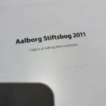 Titelblad fra Aalborg Stiftsbog 2011 med teksten 'Udgivet af Aalborg Stifts Landemode'